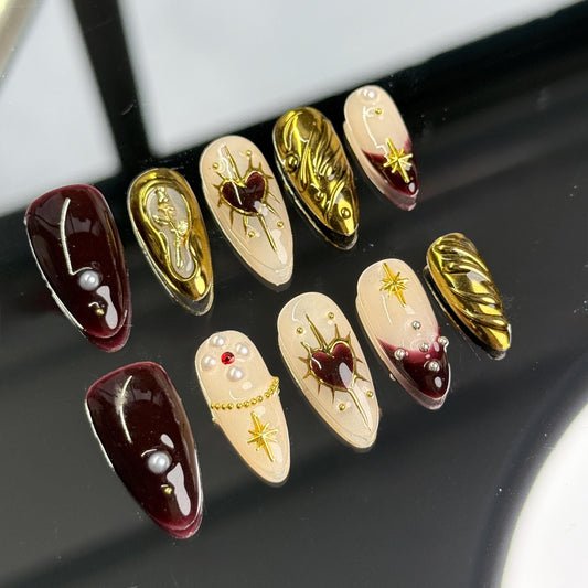 Regal Romance almond-shaped nail art Set with rich burgundy and gold designs, featuring hearts, pearls, roses and stars