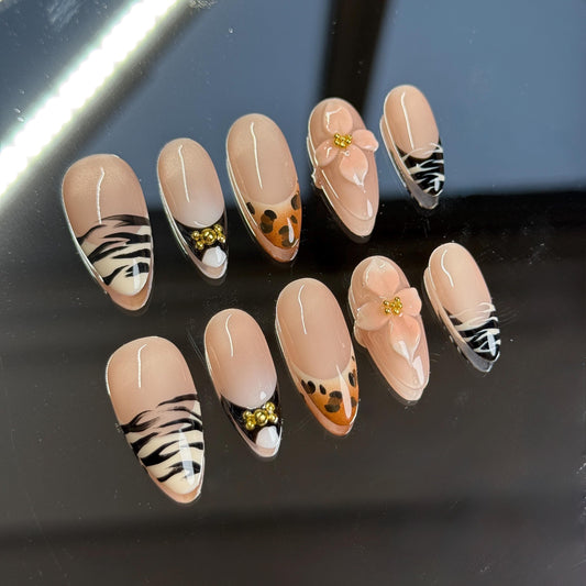 Wild & Chic almond shape press-on nails set zebra, leopard, and floral designs. Perfect for bold, stylish looks. Handmade 3D Animal Print