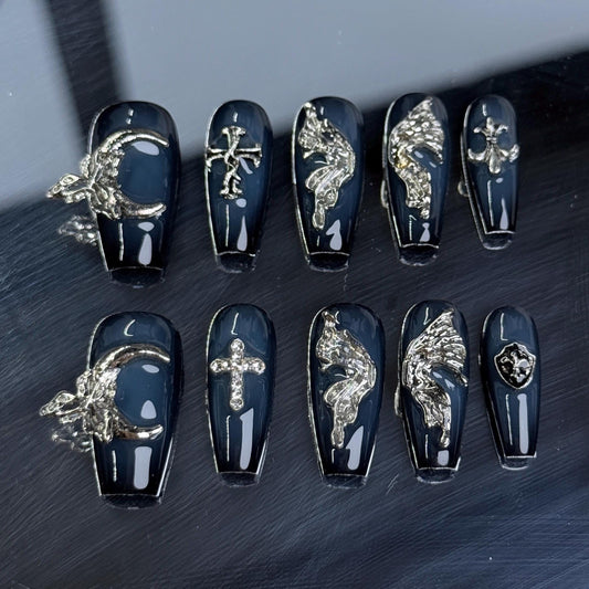 Gothic Wings Coffin Handmade nail art set with gothic black and silver designs, featuring winged motifs and crosses for an edgy look.