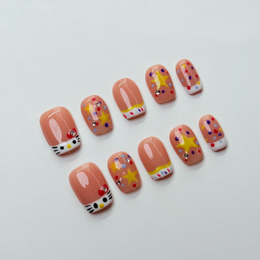 Hello Kitty Short Cute Press-On Nail Set - Cute Cat Faces, Stars & Polka Dots on Peach | Handpainted 10pcs  | Fun Adorable Cute Nail Art