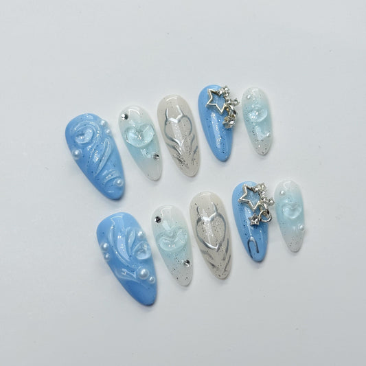 Oceanic Blue Dreamy Press-On Nails Set with Intricate Swirl Designs, Delicate Hearts, Sparkling Rhinestones, and Star-Shaped Accent