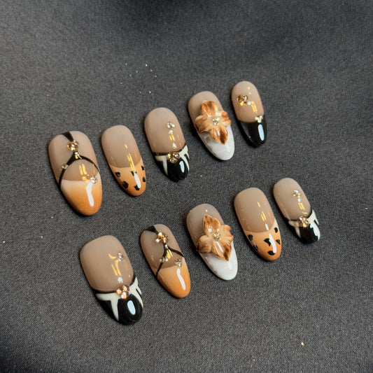 Elegant Presson Almond Handmade Nails for Fall & Winter Vibes with Gold and Dry Flower embellishment style Neutral Tone Safari Nails