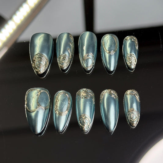 Mystic Teal Blue Chrome Almond Press-On Nails with Elegant Gold Swirl Accents for a Stunning, Reflective Finish