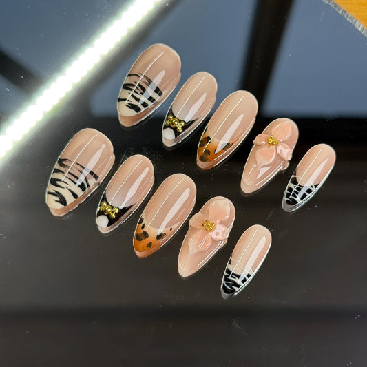 Wild & Chic almond shape press-on nails set zebra, leopard, and floral designs. Perfect for bold, stylish looks. Handmade 3D Animal Print