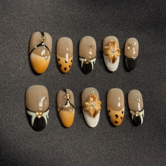 Elegant Presson Almond Handmade Nails for Fall & Winter Vibes with Gold and Dry Flower embellishment style Neutral Tone Safari Nails