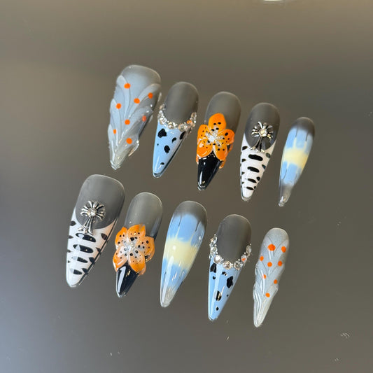 Polka Dot Exotic Style Stiletto Shape Press-on Nail Set with Blue, Grey and Orange Color Blended Design and Chrome Cross Embellishment
