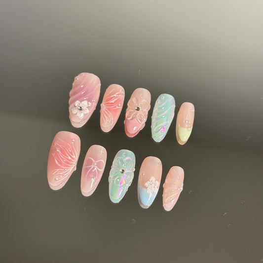 Enchanted Beautiful Handmade Pastel Press-on Nail Set Featuring Butterfly Print, Petals and Soft Pink Bow and Blue Iridescent Hues Spring